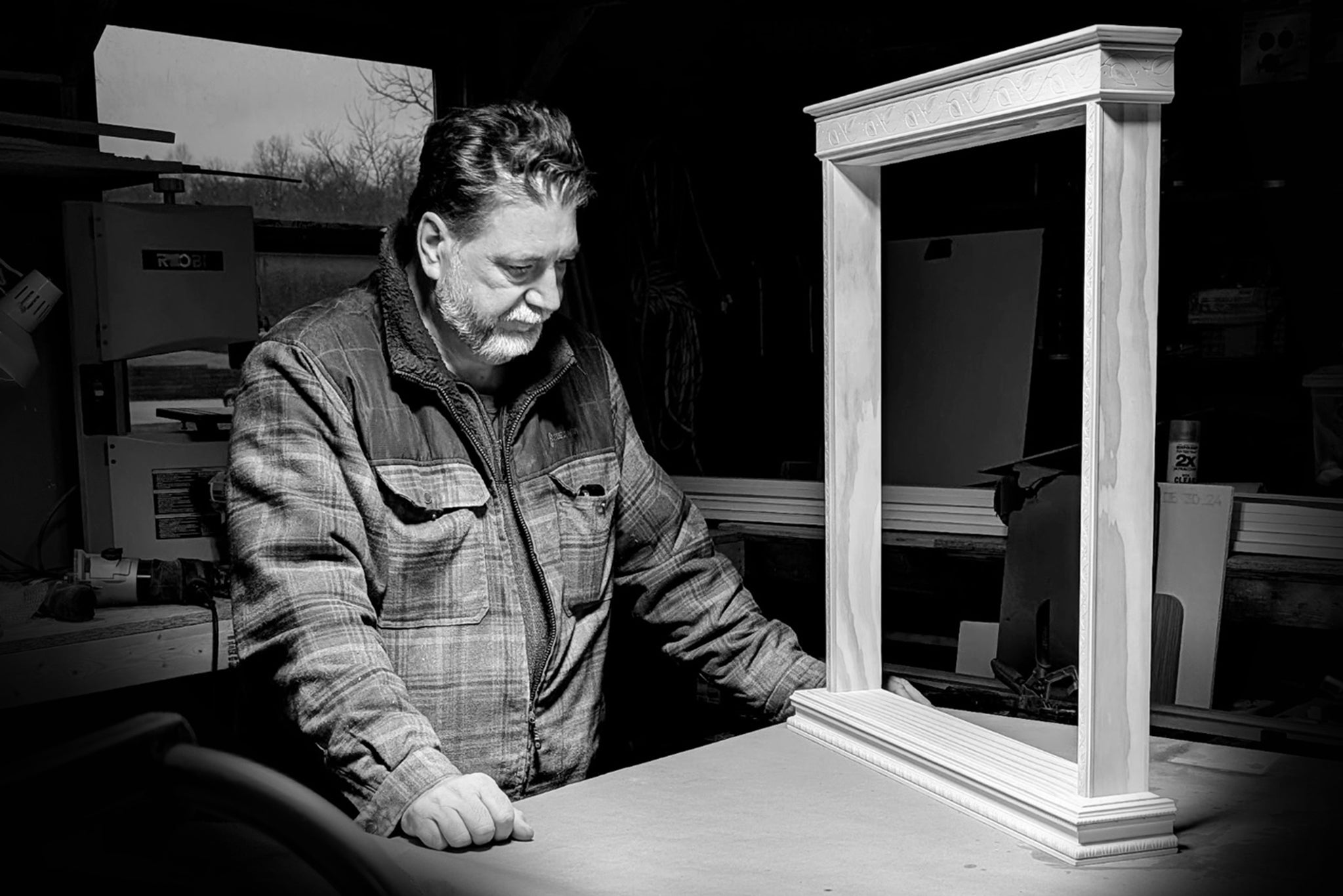 Woodworker crafting a handmade wooden Catholic home altar for prayer in a workshop